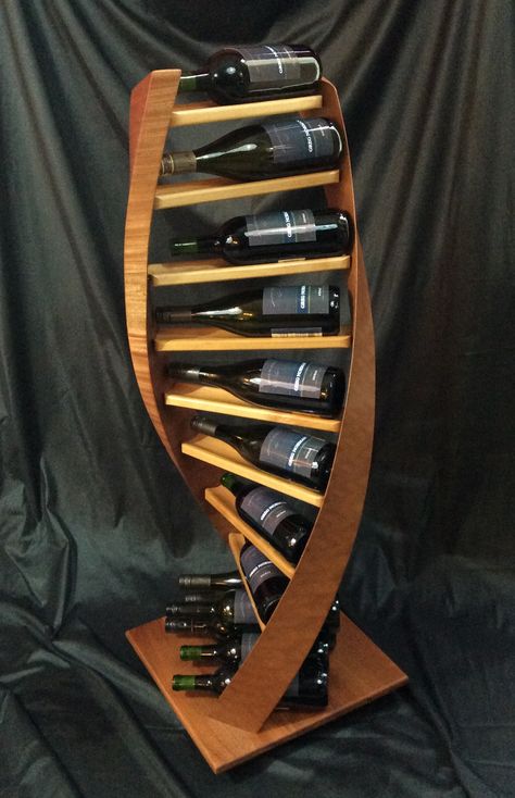 A four foot tall, double-helix inspired wine rack that shows wine the way it should be. Wine Stand Ideas, Wine Displays, Home Wet Bar, Pallet Crates, Wine Stand, Designer Coffee, Wooden Wine Rack, Wine Shelves, Wood Wine Racks