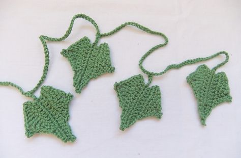 "Ivy". This Christmas crochet pattern is worked in rows and the finished ivy is 6cm (2.5”) in length . These along with some holly and mistletoe could make a perfect Christmas wreath but the ivy could also be used as a brooch, to embellish bags or simply as a decoration. Ivy © Siona Karen 2011 Crochet Ivy Leaves Free Pattern, Crocheted Wreaths, Crochet Ivy, Knitted Leaves, Crochet Plants, Crocheted Christmas, Crochet Embellishments, Crochet Wreath, Christmas Crochet Pattern