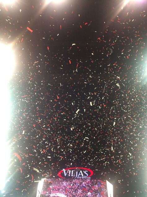 When the San Diego State University men's basketball team won the mountain west title, tons of red and white confetti came falling down from the ceiling of Viejas Arena while the crowd rushed the court to celebrate with the team. Basketball On Fire, Usa Olympics Basketball 2024 Wallpaper, Confetti Falling, Concert Arena, Arena Concert, Nba Arenas, Work Vision Board, Girls Basketball Shoes, San Diego State University