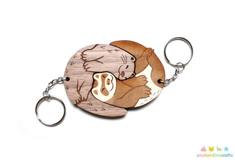 This ferret and river otter are engraved and cut from beautiful maple and walnut wood. They fit perfectly together, and the natural wood grain finish create a unique set! My original interlocking charm design is slightly less than 3.25" inches wide when linked together. The individual keychains on their own are close to 2.25" inches wide each. They are laser-cut in-house from maple and walnut veneered plywood that is approximately 1/4" thick. This listing is for the set of two keychains, they ar Laser Cut Jewelry Wood, Laser Cut Projects, Laser Cut Keychain, Friendship Keychains, Veneer Plywood, River Otter, Wood Keychain, 3d Laser, Keychain Set