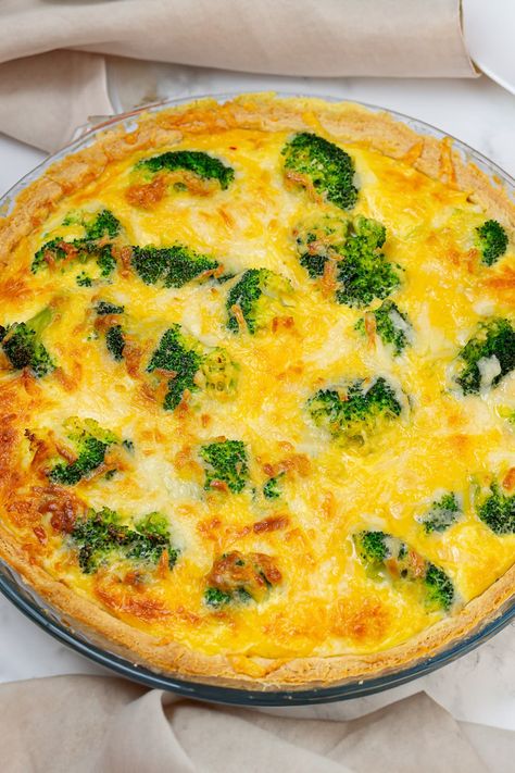 Discover the ultimate comfort food with our Broccoli Cheddar Cheese Quiche recipe. This savory, mouth-watering quiche combines tender broccoli florets with rich cheddar cheese, baked to perfection in a flaky crust. Whether you're looking for an impressive brunch option or a hearty weeknight dinner, our easy-to-follow recipe ensures a delicious meal every time. Broccoli And Cheese Quiche Easy, Broccoli Quiche Recipes Easy, Cheese And Broccoli Quiche, Cheddar Cheese Quiche, Broccoli And Cheese Quiche, Broccoli Cheese Quiche, Quiche Easy, Broccoli Quiche Recipes, Broccoli Cheddar Quiche