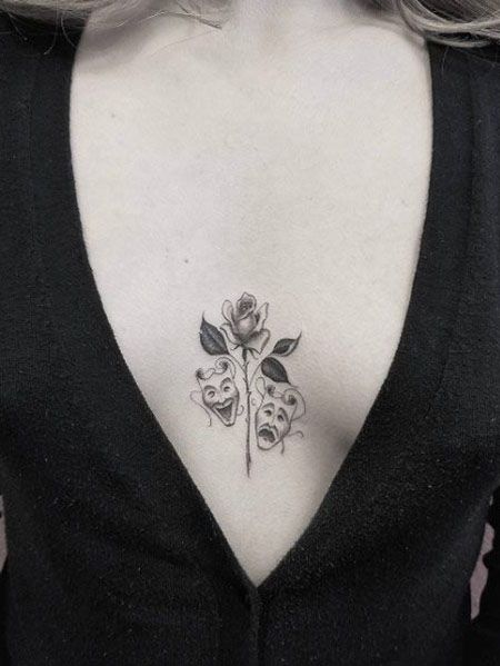 50 Best Chest Tattoos for Women - The Trend Spotter Theater Mask Tattoo, Herren Hand Tattoos, Tattoos For Females, Under Chest Tattoo, Small Chest Tattoos, Omerta Tattoo, Cool Chest Tattoos, Chest Tattoos, Back Of Shoulder Tattoo