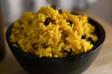 South African Yellow Rice is slightly sweet and has hints of cinnamon, tumeric, and plump raisins. It goes well with savory dishes, as well as any curry.  #rice #southafrican #sidedish #cinnamon #tumeric Yellow Rice With Raisins, African Yellow Rice, Rice With Raisins, African Rice, Salad Board, Cultural Food, Side Chick, Salted Caramel Fudge, Rice Recipes For Dinner