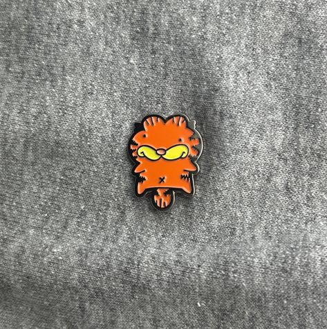 The most popular sticker in my store is now a pin! Know a cat lover and/or Garfield lover? This is the perfect gift for them!  All pins are created and plated with high-quality enamel with a rubber clutch. Add flair to anything you put it on! Put it on a shirt, corkboard, backpack, ceiling, your best friend, almost anywhere! 𝗦𝗽𝗲𝗰𝘀: 𝗛𝗲𝗶𝗴𝗵𝘁: 1 inch 𝗣𝗼𝘀𝘁𝘀: One 𝗠𝗮𝘁𝗲𝗿𝗶𝗮𝗹: Enamel 𝗖𝗹𝘂𝘁𝗰𝗵: Rubber Contact me anytime through direct messages through Etsy if you have any questions, comments, concerns, suggestions, or even ideas for designs that might be popular! I appreciate talking with you all and I always appreciate the love and support! Cute Pins For Backpacks, Garfield Lasagna, Backpack With Pins, Enamel Pin Backpack, Garfield Pictures, Pins For Backpacks, Garfield Images, Backpack Pins, Cool Pins