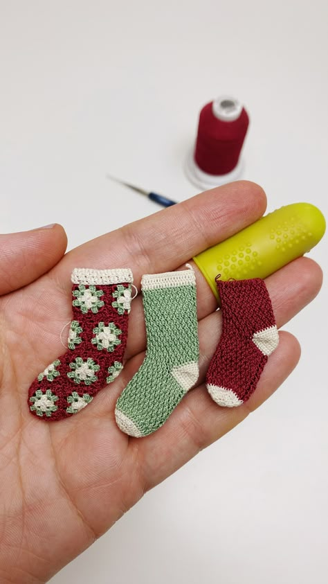 Here's a fun fact: I've never crocheted a pair of full-sized socks before, but this year, I decided to conquer my fear of turning heels. Now, I'm all in, crocheting a whole bunch of tiny stockings 🧦🧦🧦 It's a mini Christmas miracle in the making! Crochet Miniature Christmas Ornaments, Tiny Christmas Crafts, Miniature Crochet Patterns, Mini Christmas Stocking Pattern, Mini Stockings, Crochet Christmas Stocking, Nutcracker Ornaments, Fall Crochet Patterns, Crochet Bows