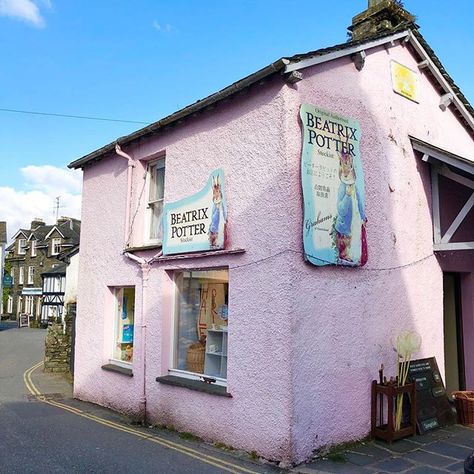 We are in the Lake District following in the footsteps of Beatrix Potter. The Beatrix Potter gallery (just up the road from this lovely, pink shop) is in the village of Hawkshead, in the old law offices which belonged to her husband, William Heelis, a local solicitor. Today, the building is owned by the National Trust and displays a selection of original prints, letters and drawings. We’ve got a full Beatrix Potter tour of the Lake District coming soon so keep your eyes peeled. Country Living U Country Living Uk, Lake District England, English Village, Pink Shop, The Lake District, England And Scotland, London Town, Pink Houses, National Trust