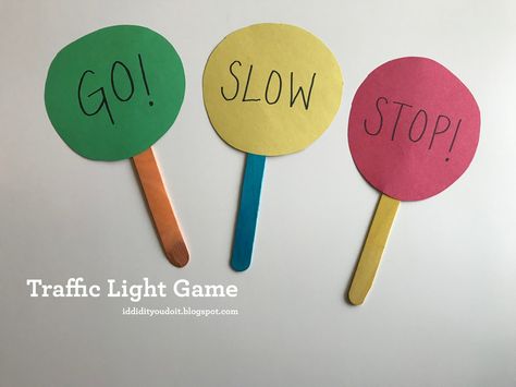 Gather a piece of green, yellow, and red construction paper, 3 craft or popsicle sticks, a black marker, scissors, and tape.          ... Traffic Rules For Kids, Safety Rules For Kids, Aktiviti Tadika, Control Game, Safety Crafts, Transportation Activities, Transportation Preschool, Light Activities, Light Games