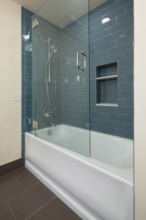 Shower in Pearl District Condo Bathroom Remodel by Hammer & Hand #subwaytile #bluesubwaytile Bathtub With Glass Door, Glass Shower Tub, Tub With Glass Door, Bathroom Tub Shower Combo, Glass Bathtub, Makeover Kamar Mandi, Bathtub Shower Combo, Tub Remodel, Condo Bathroom