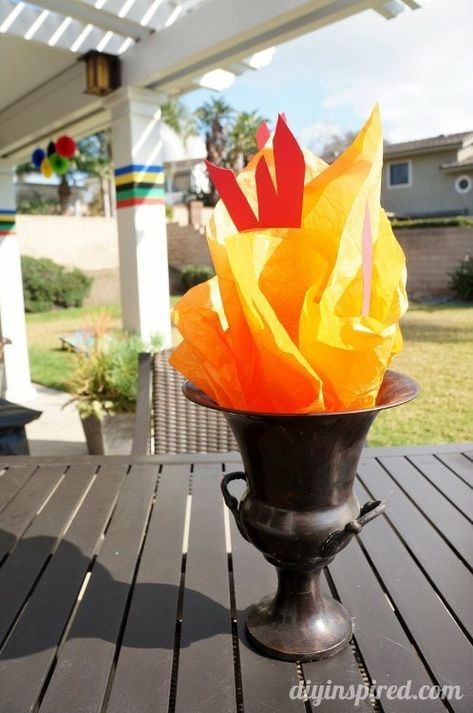 Olympic Torch Decoration Ideas (1) Torch Decoration, Couples Olympics, Olympic Vbs, Summer Olympics Party, Vbs Olympics, Office Olympics, Olympics Decorations, Olympic Theme Party, Olympics Party