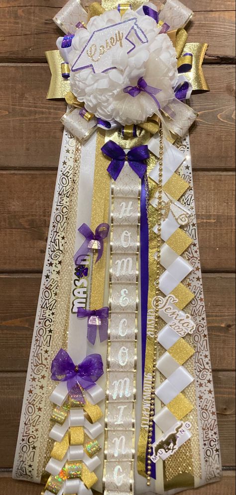 30” senior mum with purple accents Purple And Gold Mums Homecoming, Purple And Gold Homecoming Mums, Hoco Court, Hoco Mums, Homecoming Mums Senior, Purple Mums, Graduation Cap Decoration Diy, Mum Ideas, Homecoming Spirit