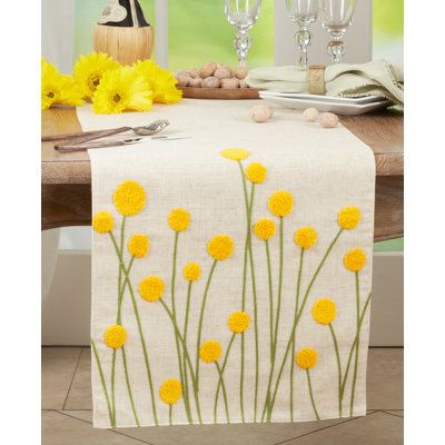 This gorgeous Embroidered Flowers Table Runner brings light, colour and life to your table décor, as well as a smile on anyone's face with its whimsical design and floral embroidery. The essence of Spring or Summer, this linen blend runner certainly brightens up your table. Pair it with solid colours to let the design stand. | Saro Table Runner White/Yellow 16.0 in, Polyester | THJL5543 | Wayfair Canada Contemporary Table Runners, Dining Table Runners, Yellow Wildflowers, Embroidered Table Runner, Pola Sulam, Chic Flowers, Whimsical Design, Linen Table Runner, Hand Embroidery Designs