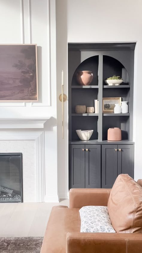 Iron Ore Built In Cabinets Fireplace, Black Arch Built In, Black Arched Built Ins, Dark Painted Built Ins, Arched Bookcase Built In Fireplace, Built In Cabinets Living Room Fireplace, Arched Bookshelf Built Ins, Fireplace With Arched Built Ins, Paint Back Of Bookcase Built Ins