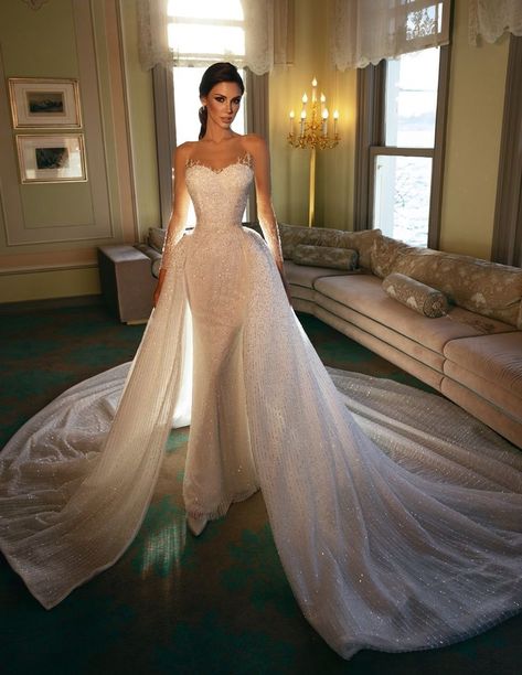 This Dovita princess wedding dress features a spectacular two-piece effect covered in thousands of refined embellishments throughout the entire gown with illusion sleeves and long train. Wedding Dress With Removable Train, Dress With Removable Train, Princess Bride Costume, October Wedding Dresses, Illusion Neckline Wedding Dress, Bella Bridal, Backless Bridal Gowns, Wedding Dress Sequin, Beaded Tulle