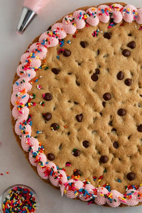 Get ready to celebrate any occasion with this soft and chewy chocolate chip cookie cake! Decorate it with a classic vanilla buttercream frosting or add your own favorite toppings to make it fun for your special day. Perfect for birthdays! Chocolate Chip Cookie Cake Recipe, Pastel Desserts, Giant Chocolate Chip Cookie, Cookie Cake Birthday, Ambitious Kitchen, Chocolate Chip Cookie Cake, Cookie Cake Recipe, Vanilla Buttercream Frosting, Recipe Girl