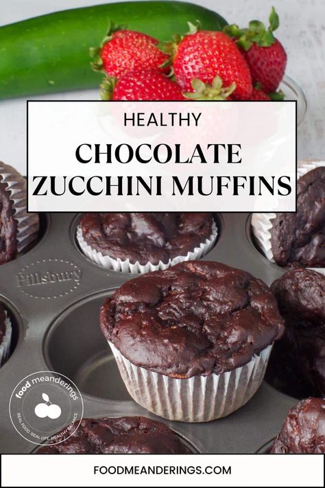 Healthy Chocolate Zucchini Muffins in a muffin tin , with one on top and strawberries and a zucchini in the background Healthy Chocolate Zucchini Muffins, Muffins Zucchini, Zucchini Healthy, Double Chocolate Zucchini Muffins, Zucchini Cupcakes, Zucchini Muffin, Zucchini Muffins Healthy, Chocolate Zucchini Muffins, Resepi Biskut