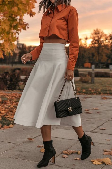 Woman wearing a burnt orange crop shirt, white skirt, and black boots, standing in a park during autumn. Style Fall, How To Style, My Profile, Burnt Orange, Fall Colors, Fall Outfits, Autumn Fashion, Outfit Ideas, Wardrobe