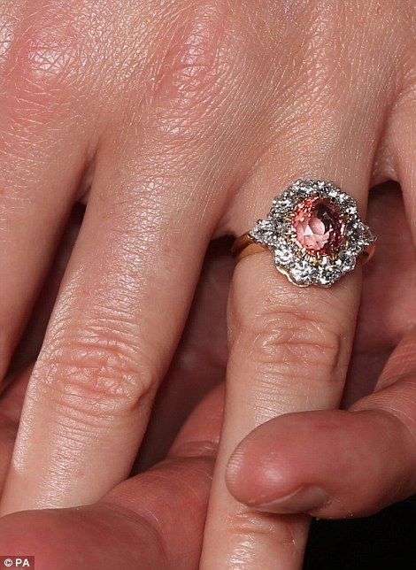 Her padparadscha sapphire surrounded by diamonds is not unlike the Duchess of Cambridge's ring in style, which once belonged to Princess Diana Princess Eugenie Engagement Ring, Royal Engagement Rings, Jack Brooksbank, Yellow Citrine Ring, Original Engagement Rings, Vintage Inspired Rings, Estilo Real, Vintage Jewellery Rings, Sarah Ferguson