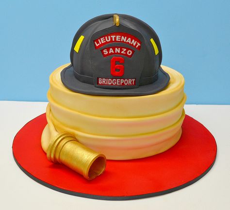 Fireman Helmet and hose Cake by LovelyCakes.net, via Flickr Fire Helmet Cake, Firefighter Birthday Cakes, Fire Engine Cake, Helmet Cake, Fire Fighter Cake, Fireman Cake, Fire Cake, Fireman Helmet, Firetruck Birthday Party