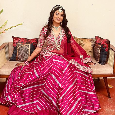 A beautiful Zari bride in our hot pink leheriya Lehenga 🩷 www.zarijaipur.com | DM to book your video call consultation for your bridal shopping and bridal trousseau. #ZariJaipur #IndianBride #RajasthaniBride #BridesOfIndia #RajasthaniWedding #JaipurWedding #DestinationWedding #IndianWedding #IndianWeddingBride #BrideInPink #leheriyasarees #leheriyalehenga Leheriya Lehenga, Rajasthani Bride, Bridal Trousseau, Indian Wedding Bride, Video Call, Bridal Shop, Indian Bride, Indian Wear, Jaipur