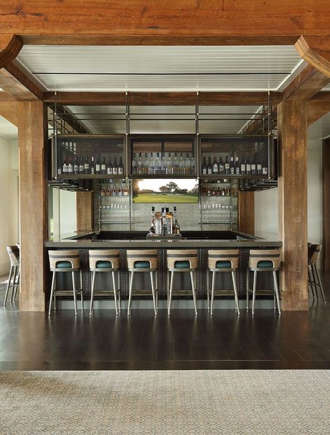 For Sugarloaf Country Club in Georgia, Amuneal fabricated this Ceiling Mounted Shelving Unit that overhangs the bar. Featuring Gunmetal posts, Warm Brass fittings, and Oxidized Oak cabinets with Blackened Steel mesh panels, the unit is a stunning statement piece that stores and displays spirits. #barideas #barshelvingideas #bardesign #restaurantshelving #restaurantshelves #openshelving #openshelves #interiordesignideas #homedecorideas Restaurant Shelves, Back Bar Shelving, Restaurant Shelving, Bar Shelving, Bar Ceilings, Back Bar, Blackened Steel, Oak Cabinets, Brass Fittings