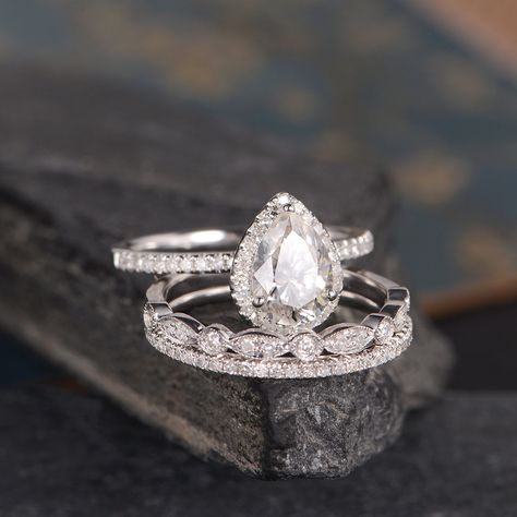 "White Gold Bridal Set Moissanite Engagement Ring Pear Shaped Diamond Halo Women Antique Ring Anniversary Gift For Women Drop Tear To see engagement ring set: https://www.etsy.com/listing/540502901 https://www.etsy.com/listing/565073589 ITEM INFORMATION Metal Type - Solid 14k White Gold Band Width - (approx. 1.3mm) *Engagement Ring* Band Width- 1.4mm Center Stone - 6*8mm Moissanite, Pear Shaped Side Stone - Natural Diamond Weight - 0.24ct Clarity -SI Color - H *Pave Wedding Band* Band Width: 1.4 Weddings Rings, Wedding Tools, Gold Bridal Set, White Gold Bridal Set, Pretty Engagement Rings, Pear Shaped Engagement Rings, Yellow Engagement Rings, Ring Styles, Aquamarine Engagement Ring