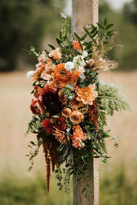 Deep reds, terracottas, peaches and greens! Perfect color combo for your rustic, romatic, farm wedding! Red Peach And Green Wedding, Dried Wedding Flowers Bouquets, Burgundy Rust Peach Wedding, Terracotta And Green Wedding Flowers, Copper Wedding Florals, Vinyard Wedding Fall, October Farm Wedding, Fall Wedding Floral Arrangements Ceremony, Rustic Wedding Floral Arrangements