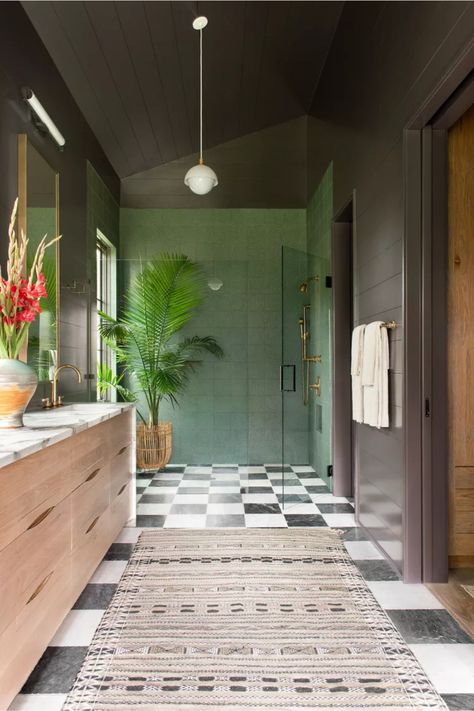 "Step into this dreamy tropical bathroom with classic black and white checkered floors! 🌿 Love how the sage green walls and palm plants create the perfect spa vibe.   Checkerboard bathroom floor Black and white tile pattern Sage green bathroom Tropical bathroom design Modern boho bathroom Bathroom runner rug Wooden bathroom vanity  Palm bathroom decor Gold bathroom fixtures Luxury master bathroom Green bathroom walls Classic bathroom design Bathroom plant decor Statement floor pattern Bohemian Shower Ideas, Shiplap Bathroom, Sullivans Island, Interior Design Consultation, Surf Shack, Bathroom Floor Tiles, Interior Design Tips, Bathroom Flooring, Wall Paneling