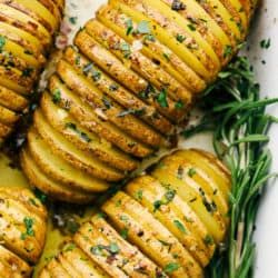 Garlic Butter Hasselback Potatoes - The Recipe Critic The Recipe Critic, Lemon Potatoes, Hasselback Potatoes, Recipe Critic, Potato Recipes Side Dishes, Not Fair, Side Dish Recipes Easy, Potato Sides, Herb Butter