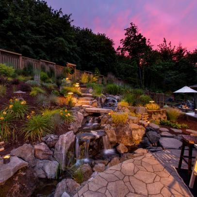 Outdoor Space and Backyard Pictures | HGTV Photos Backyard With Hill, Terraced Slope, Waterfall Landscaping, Patio Edging, Terraced Garden, Outdoor Eating Area, Landscaping On A Hill, Outdoor Gathering Space, Backyard Playhouse