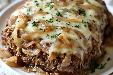 Introduction This Crockpot French Onion Meatloaf with Melted Swiss Cheese is a comforting, flavorful twist on the classic meatloaf, combining the savory depth of French onion soup with the rich ... Learn more Lilys Bites, French Onion Meatloaf, Savory Meatloaf, Perfect Meatloaf, Meatloaf Mix, Leftover Meatloaf, Traditional Meatloaf, Classic Meatloaf, Caramelized Onion