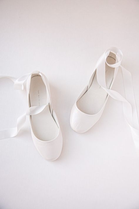 "Bridal ballet flats in Pearl Ivory with satin ribbons and leather ankle straps. The tone is in a warmer light ivory with a soft shine. Sustainably made by a women based shoemakers' workshop.  * Standard fit & generally runs true to size * The design is super flattering on all feet shapes and sizes * Leather lining with leather soles (3mm) & anti slip rubber heels (8mm) * Our ballet flats are entirely handmade by us with the highest quality of ethically sourced leather * We ship globally. Estimated delivery times by location are listed in our FAQs, policies, and shipping section of each listing *video is in Luna Blush Nubuck (Pearl Ivory is made in the same design) ✒︎ ✒︎ ✒︎ SHIPPING UPDATE (from 2024) for customers outside of Germany; if you would like to place an order for more than one p Ballet Flats Wedding Shoes, Bride Shoes Flats, Bridal Ballet Flats, Flat Wedding Shoes, Shoes For Brides, Wedding Ballet Flats, Satin Ballet Flats, White Flat Shoes, Bridal Lehenga Collection