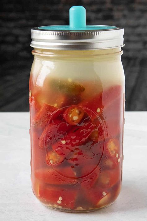 Fermented Hot Sauce Recipe - I grew loads of peppers in my garden this year just so I could make this fermented hot sauce recipe. It is wonderfully spicy and big on flavor. Drizzle it over anything. Works for any type of peppers. #HotSauce #Serranos #SpicyFood Fermented Ghost Pepper Hot Sauce Recipe, Fermented Cayenne Pepper Sauce, Fermenting Hot Peppers, Fermented Tabasco Sauce, Fermented Serrano Hot Sauce, Fermenting Peppers For Hot Sauce, Fermented Cayenne Peppers, Fermented Hot Sauce Recipe Homemade, Fermented Hot Peppers