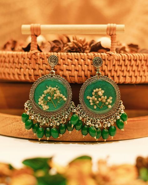 Handmade customized resin jhumkas with real dried pressed flowers, preserved in epoxy resin, embedded in traditional jhumkas ✨ DM us to get customized jhumkas ✨ #resinjewelry #resinart #resin #handmade #resinartist #handmadejewelry #resinartwork #resincraft #epoxyresin #jewelry #resinmolds #art #resinearrings #smallbusiness #epoxy #resinjewellery #resincrafts #resincharms #resina #earrings #epoxyart #etsy #resinpendant #resinnecklace #glitter #artist #resincoasters #resincasting #handmadewi... Traditional Jhumkas, Doll Miniatures, Dried Pressed Flowers, Diy Doll Miniatures, Fancy Jewellery Designs, Dried And Pressed Flowers, Resin Artwork, Fancy Jewellery, Resin Casting