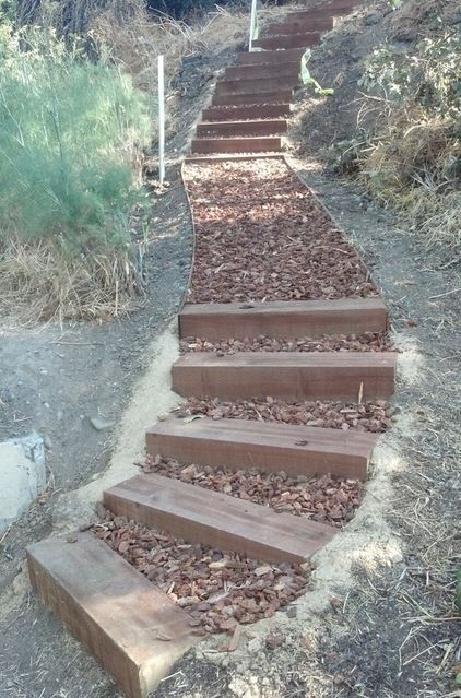 Outdoor stairs on hillside Outdoor Steps On A Slope Hill Landscaping, Path On Sloped Yard, Stairs In A Hillside, Stairs In Hill, Steep Hillside Steps Outdoor Stairs, Lake Stairs Outdoor, Hillside Pathway Walkways, Rail Road Tie Steps, Railroad Tie Stairs