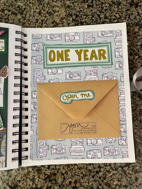 Theres a letter in the envelope #scrapbooking Scrapbook Design Ideas For Boyfriend, Spiral Scrapbook Ideas, Scrapbook With Letters, Memory Book First Page, Envelope Scrapbook Ideas, 1 Year Anniversary Journal Ideas, 1year Anniversary Boyfriend Scrapbook, Dad Scrapbook Ideas, A Year Of Us Scrapbook