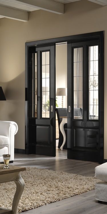 .pocket doors: French Style Living Room, French Living Room Design, Architecture Renovation, French Living Rooms, Black Interior Doors, French Doors Interior, Black Doors, Interior Barn Doors, Pocket Doors