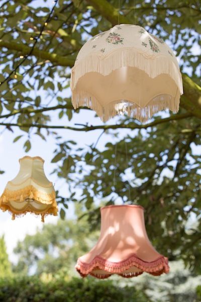 Vintage Wedding Lighting, Romantic Reception Ideas, Vintage Wildflower Wedding, Vintage Chandelier Wedding, Hanging Lamp Shades Wedding, Lampshade Tree, Vintage Garden Party Wedding, Paper Lanterns Trees Wedding, Garden Party Wedding Parasol