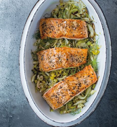 Salmon with Leeks, Fennel and Lemon | Baking salmon on top of leeks and fennel is an easy method for preparing the flavorful fish, and it takes less time than cooking all the components separately. Fennel Salmon Recipes, Salmon With Leeks, Leek And Salmon Recipe, Salmon And Leek Recipes, Fish And Leeks Recipe, Salmon And Leeks, Leek And Fennel Recipe, Salmon And Leeks Recipe, Salmon Fennel Recipe