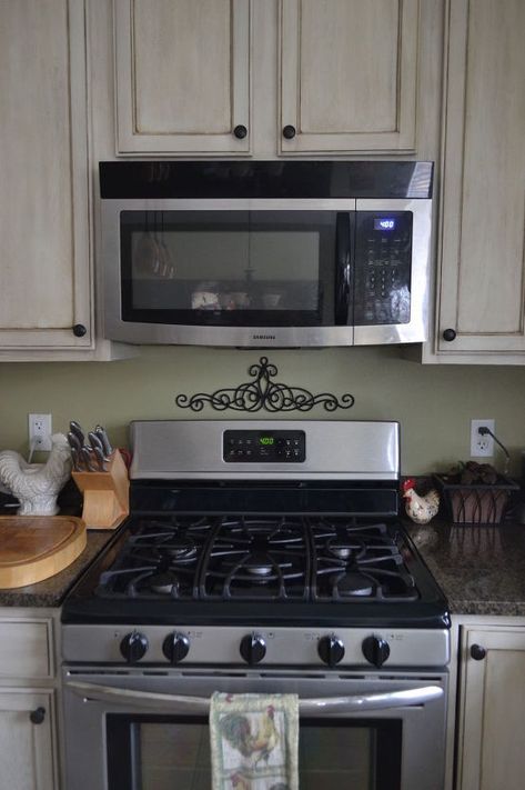 easy and affordable diy tuscan microwave hood vent update, appliances, how to, kitchen design Above The Range Microwave, Vent Hood Ideas, Tuscan Home Decorating, Cheap Beach Decor, Old World Kitchens, Hood Ideas, Microwave Hood, Hood Vent, Kitchen Drawing