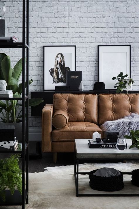 modern industrial living room with tan leather sofa and concrete coffee table Sofa Kulit, Industrial Chic Interior, Cafe Industrial, Modern Industrial Living Room, Urban Industrial Decor, Tan Leather Sofas, Living Room Industrial, Industrial Cafe, Cafe Chair