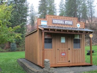 General Store - by Sturdy Built Sheds, LLC General Store Playhouse, General Store Shed, Country Shed Ideas, Old West General Store, Western Shed Ideas, Mini General Store, Food Storage Shed, General Store Ideas Small Towns, Boy Playhouse