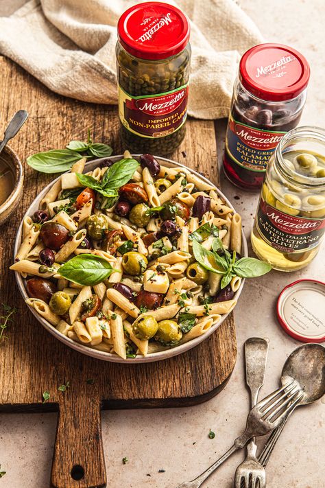 This Penne Pasta Salad with Olives is the perfect way to complete your next feast! The recipe is easy to make, requires minimal cooking and it comes together so quick thanks to Mezzetta products! Gluten-free pasta is tossed with Mezetta’s pitted greek kalamata olives, castelvetrano olives and capers. Kalamata and Castelvetranos olives make truly the best combination! | NattEats #Mezzetta #MezzettaMakesItBetta #olivepastasalad Penne Pasta Salad, Green Olive Salad, Penne Pasta Salads, Salad With Olives, Pasta With Olives, Castelvetrano Olives, Olives Kalamata, Mediterranean Meals, Olive Salad