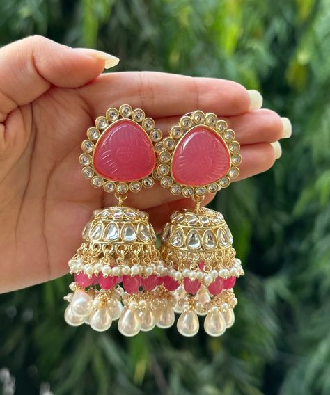 Beautiful engraved Jhumka earrings available in 2 stunning variations of pink. These earrings are high quality and are made to last. They are not too heavy and will be fine to wear all day long. They surely add a statement to any look! In case of any queries, please feel free to reach out. Happy shopping! Earrings For Pink Dress, Pink Jhumka, Jhumka Collection, Kundan Jhumkas, Kundan Jhumka Earrings, Desi Jewellery, Pakistani Jewellery, Jhumka Designs, Earrings For Wedding