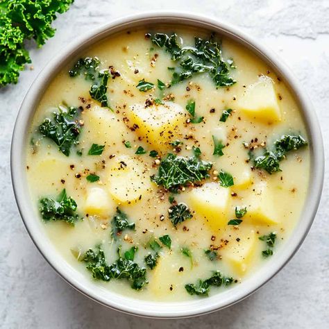 Potato and Kale Soup (Zuppa Toscana Style) – A hearty soup with chunks of potato, vibrant kale leaves, and herbs, served in a light bowl and topped with black pepper. Creamy Potato Kale Soup, Sweet Potato Kale Soup Slow Cooker, Soup Zuppa Toscana, Potato And Kale Soup, Potato Kale Soup, Kale Potato Soup, Green Chili Soup, Irish Potato Soup, Potatoes Soup