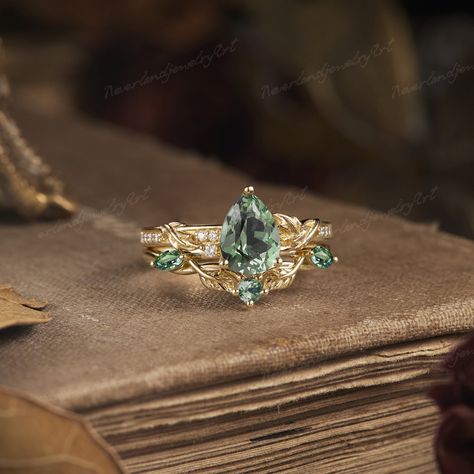 Gold Green Rings, Wedding Rings Sage Green, Forest Green Engagement Ring, Woodland Engagement Ring, Green Sapphire Ring Engagement, Dream Engagement Rings Unique, Forest Wedding Ring, Princess Cut Engagement Rings Gold, Nature Inspired Engagement Rings