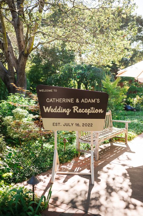 A wedding welcome sign that resembles a National Park sign reads: Welcome to Catherine & Adam's Wedding Reception EST. July 16, 2022 Wedding At State Park, National Park Welcome Sign, Campground Wedding Decorations, Outdoor Wedding Details, Elopement Reception Decor, Outdoorsy Themed Wedding, Outdoorsy Wedding Decorations, National Park Wedding Sign, National Park Wedding Decor