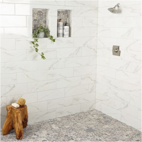 Create a spa experience in your own home. The Delfino stone collection by American Olean features a diverse selection of unique mosaic tile including this gorgeous gray pebble mosaic. Natural stone pebbles mounted onto a 12-in x 12-in sheet create an eye-catching finish to any space. American Olean Delfino Stone Bali Gray Blend 12-in x 12-in Unglazed Natural Stone Mixed Pebble Stone Look Floor and Wall Tile (1-sq. ft/ Piece) Stone Shower Floor, Pebble Tile Shower, Master Shower Tile, Pebble Shower Floor, Marble Shower Tile, White Tile Shower, Subway Tile Showers, Pebble Floor, Subway Tiles Bathroom