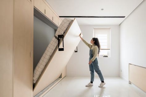 Photo 11 of 11 in The Rooms in This Tiny Apartment Change Size at the Push of a Button - Dwell Micro Apartment Ideas, Tiny Apartment Design, Corner Storage Unit, Micro Apartment, Hidden Bed, Dining Room Cozy, Flexible Space, The Push, Micro House