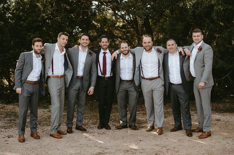 Groomsmen in different shades of grey with the Groom in the darkest shade. They all wore burgundy suspenders, while only the Groom wore a burgundy tie. Groomsmen Attire Suspenders, Dark Grey Groomsmen, Mismatched Groomsmen, Grey Groomsmen, Gray Groomsmen Suits, Groomsmen Ideas, Groomsmen Suspenders, Wedding Groomsmen Attire, Groomsmen Grey