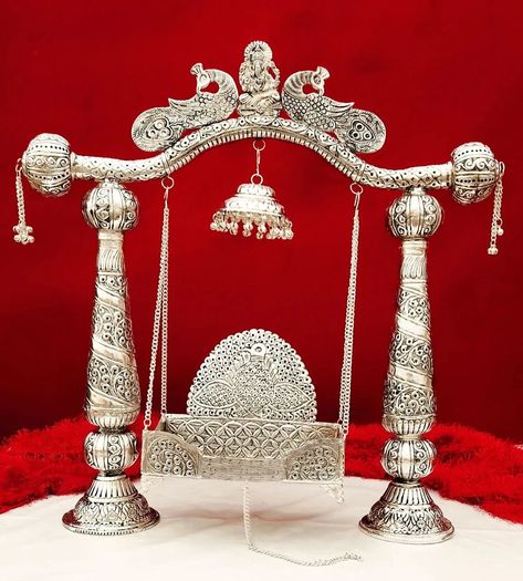 "Add a touch of divine elegance to your home with this exquisite antique German silver Krishna Jhula. Perfect for enhancing your spiritual space and invoking serenity. 🌟✨" Antique German silver jhula for kanha ji *Description* 1. Antique German silver Heavy gauge jhula with peacock 🦚 carving 2. Full detachable pattern jhula comes with chatra 3. Big size palna/ singhasan comes with 4 stand, so u can use separate plana as a singhasan 4. Available in 2 size *Description* 🛑Size - *BIG SIZE*... Peacock Carving, Krishna Jhula, Laddoo Gopal, Spiritual Space, Cinderella Wedding, Spiritual Decor, Home Temple, German Silver, Sacred Space